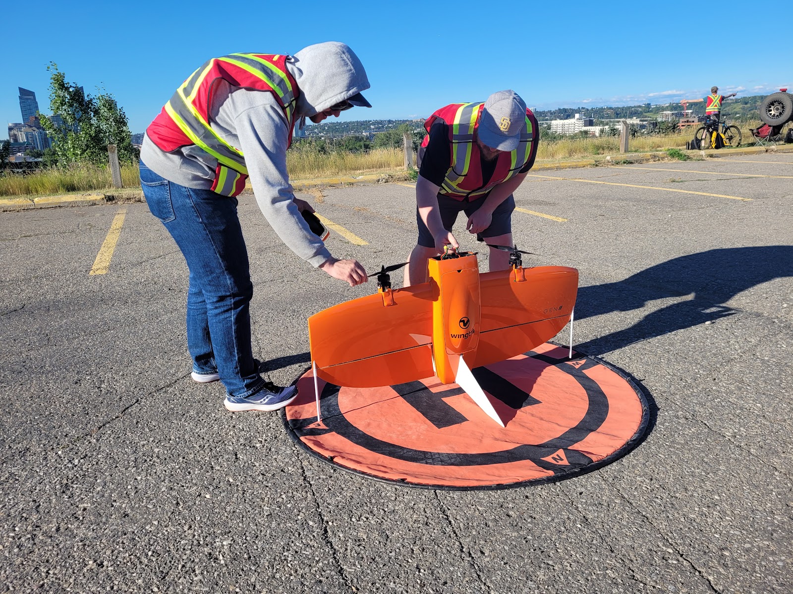 Fixed-wing VTOL drone on a landing pad ready for a corridor survey