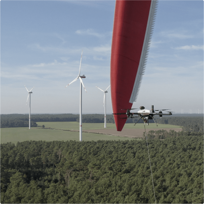 Drone inspecting a wind turbine blade in the field